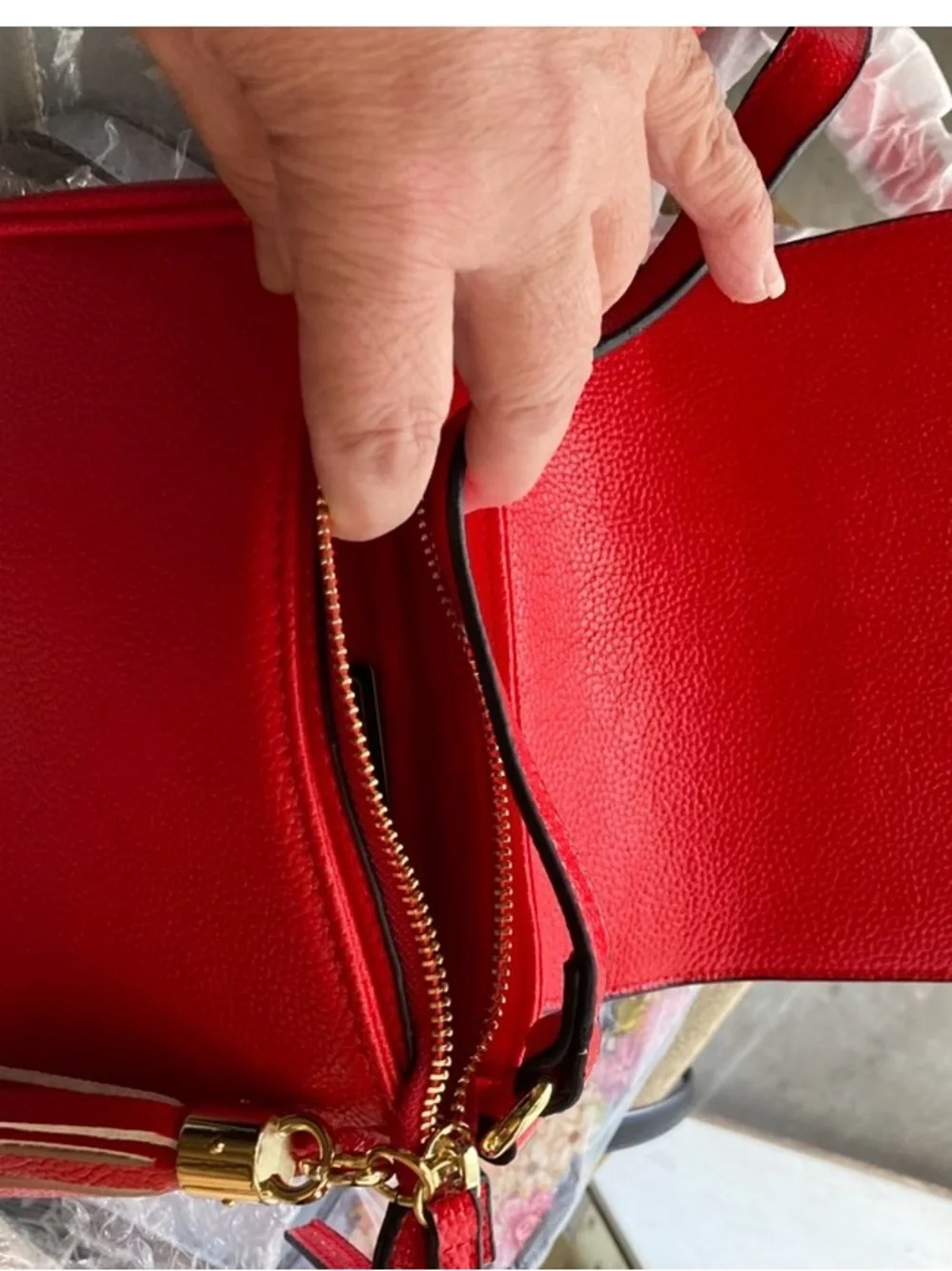 Compact Red Crossbody Bag with Tassel Accent